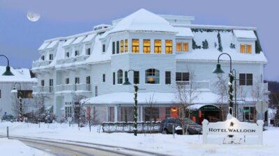 Outdoor, snowy view of Hotel Walloon