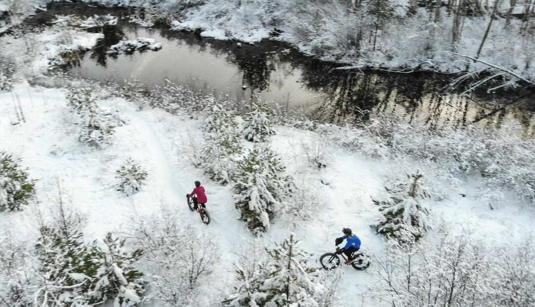 Noquemanon Trail Network by drone of people on bike